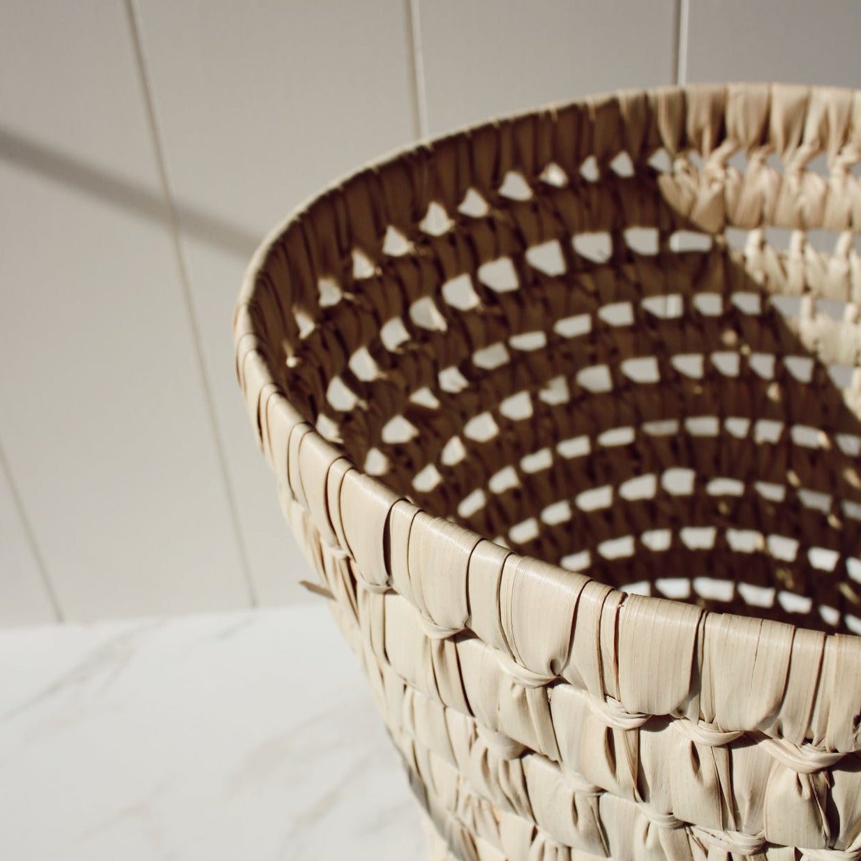 Round palm leaf basket