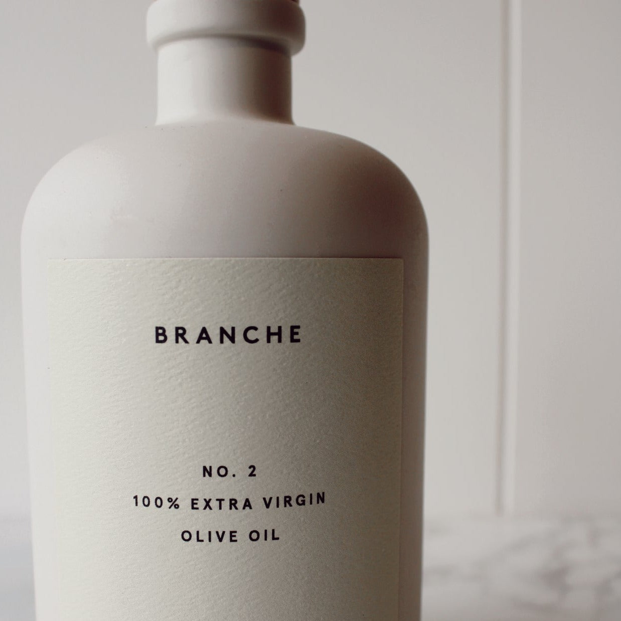 Branche Number 2 Olive Oil in Cream Matte Bottle pictured up close