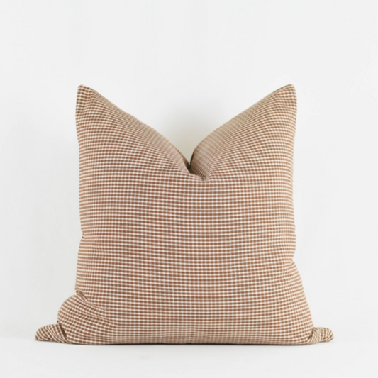 George Rust Pillow twenty by twenty, has rust and white small checkers throughout